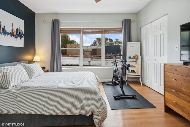 6250 N Magnolia Ave Unit 3, Chicago, IL 60660 - bedroom with wood finished floors, multiple windows, and a closet