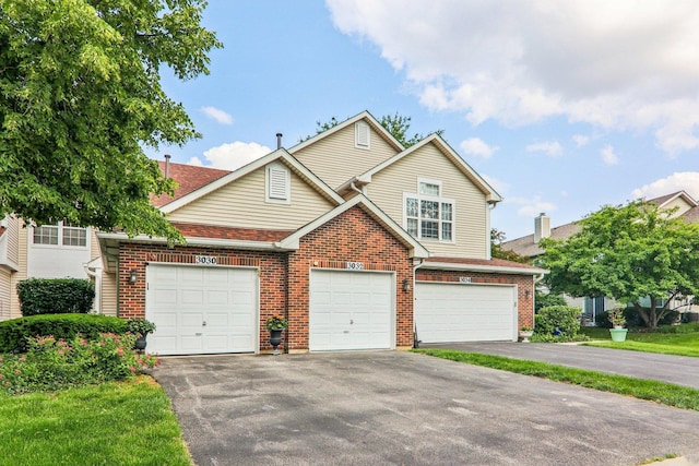 3032 Kentshire Cir, Naperville, IL 60564 - traditional-style home with asphalt driveway, brick siding, and a garage