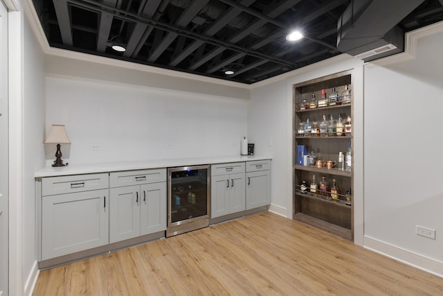 2034 Link Dr, Buffalo Grove, IL 60089 - indoor dry bar featuring beverage cooler, light wood-style flooring, and baseboards