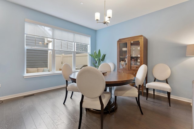 2034 Link Dr, Buffalo Grove, IL 60089 - dining space with baseboards, a chandelier, and wood finished floors