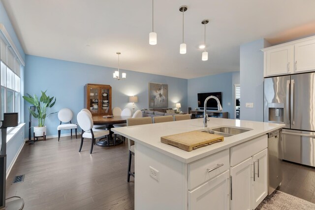 2034 Link Dr, Buffalo Grove, IL 60089 - kitchen with appliances with stainless steel finishes, a sink, plenty of natural light, and dark wood-style flooring