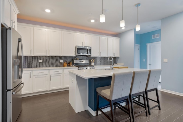 2034 Link Dr, Buffalo Grove, IL 60089 - kitchen featuring stainless steel appliances, a sink, decorative backsplash, white cabinetry, and recessed lighting