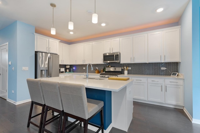 2034 Link Dr, Buffalo Grove, IL 60089 - kitchen featuring stainless steel appliances, a sink, backsplash, baseboards, and recessed lighting