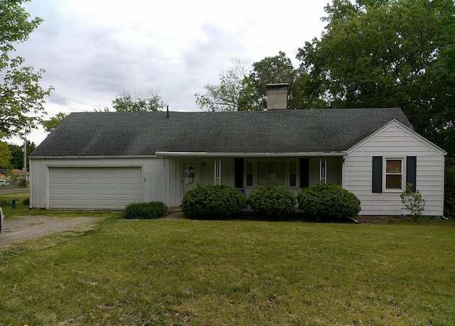 1511 N Logan Ave, Danville, IL 61832 - ranch-style home featuring a chimney, dirt driveway, a garage, and a front yard
