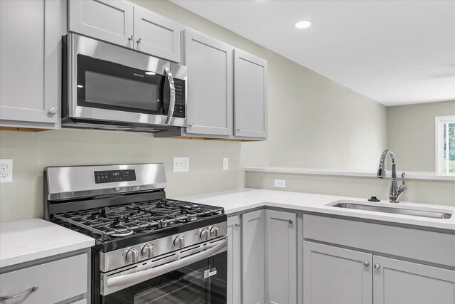 207 E Fairfield St, Fisher, IL 61843 - kitchen with stainless steel appliances, a sink, light countertops, and recessed lighting