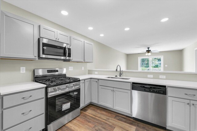 207 E Fairfield St, Fisher, IL 61843 - kitchen with stainless steel appliances, a sink, a ceiling fan, gray cabinetry, and recessed lighting