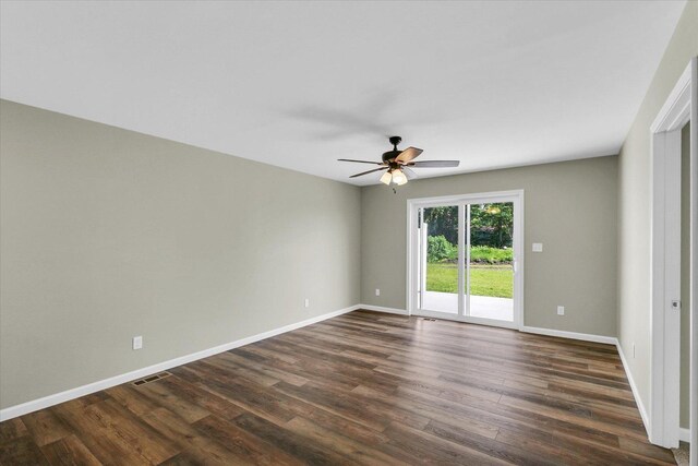 207 E Fairfield St, Fisher, IL 61843 - spare room with ceiling fan, dark wood-type flooring, and baseboards