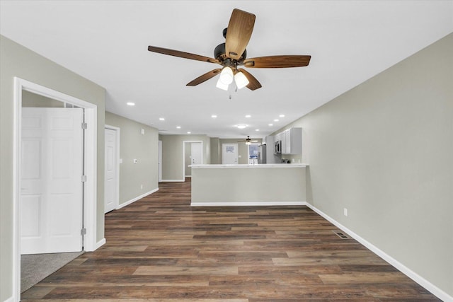 207 E Fairfield St, Fisher, IL 61843 - unfurnished living room with a ceiling fan, recessed lighting, baseboards, and dark wood-type flooring