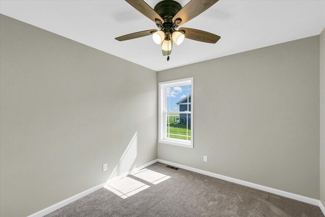 207 E Fairfield St, Fisher, IL 61843 - carpeted spare room featuring baseboards and a ceiling fan