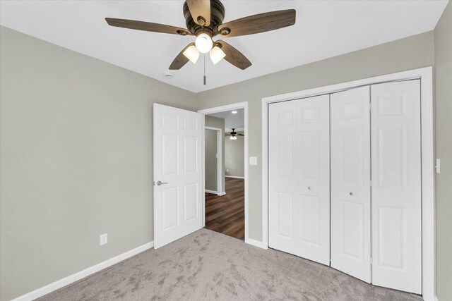 207 E Fairfield St, Fisher, IL 61843 - unfurnished bedroom featuring carpet floors, baseboards, a closet, and a ceiling fan
