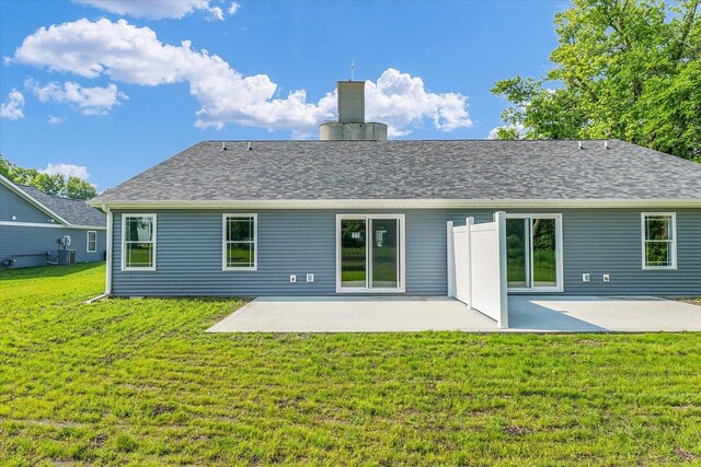 207 E Fairfield St, Fisher, IL 61843 - rear view of property featuring a lawn, a patio, a chimney, and cooling unit