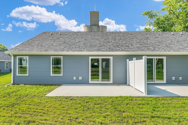 207 E Fairfield St, Fisher, IL 61843 - back of house featuring a yard, a patio, a chimney, and a shingled roof