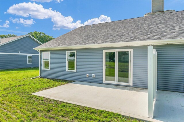 207 E Fairfield St, Fisher, IL 61843 - back of house featuring roof with shingles, a patio, and a yard