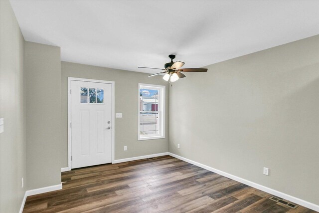 207 E Fairfield St, Fisher, IL 61843 - entryway featuring dark wood-style flooring, ceiling fan, and baseboards