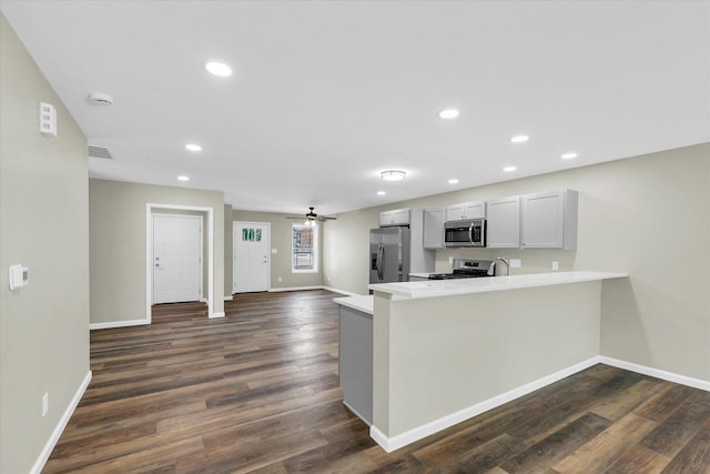 207 E Fairfield St, Fisher, IL 61843 - kitchen with appliances with stainless steel finishes, a peninsula, light countertops, baseboards, and recessed lighting