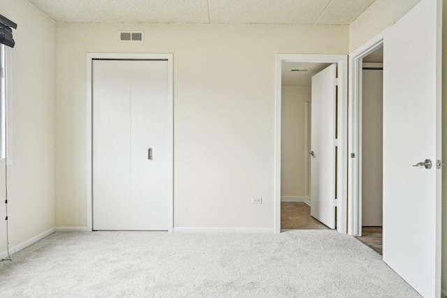 1221 Chalet Rd Unit 101, Naperville, IL 60563 - unfurnished bedroom featuring carpet flooring, a closet, and baseboards