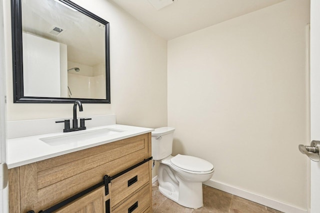 1221 Chalet Rd Unit 101, Naperville, IL 60563 - bathroom with toilet, baseboards, vanity, a shower, and tile patterned floors