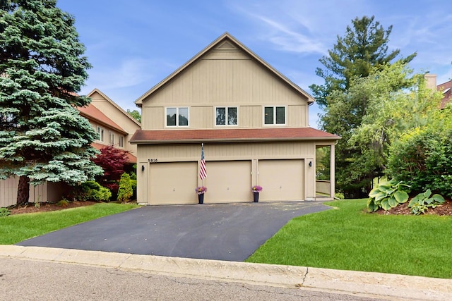 5816 Wild Plum Rd, Crystal Lake, IL 60014 - view of front of home featuring a garage, asphalt driveway, and a front lawn