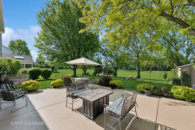 1149 Saddle Ridge Trl, Cary, IL 60013 - view of patio with outdoor dining space and a playground