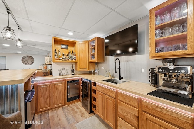 1149 Saddle Ridge Trl, Cary, IL 60013 - indoor wet bar with light wood-type flooring, beverage cooler, recessed lighting, hanging light fixtures, and a drop ceiling