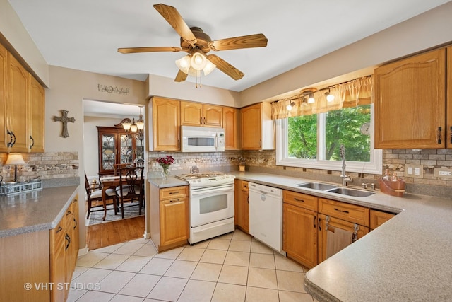 1149 Saddle Ridge Trl, Cary, IL 60013 - kitchen with white appliances, a sink, decorative backsplash, light tile patterned floors, and ceiling fan