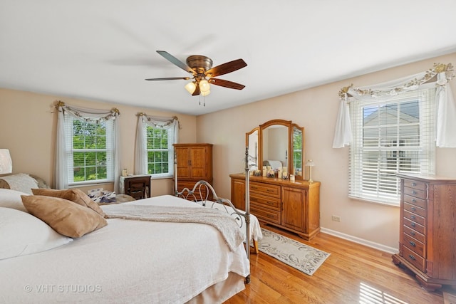 1149 Saddle Ridge Trl, Cary, IL 60013 - bedroom featuring light wood-style floors, baseboards, and ceiling fan