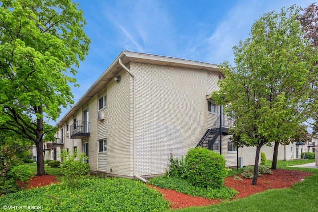 8880 Golf Rd Unit 1H, Des Plaines, IL 60016 - view of home's exterior with stairs and brick siding