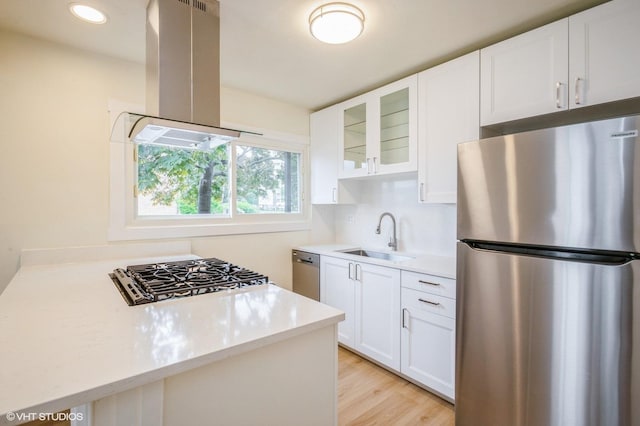 8880 Golf Rd Unit 1H, Des Plaines, IL 60016 - kitchen with stainless steel appliances, island range hood, a sink, light countertops, and recessed lighting
