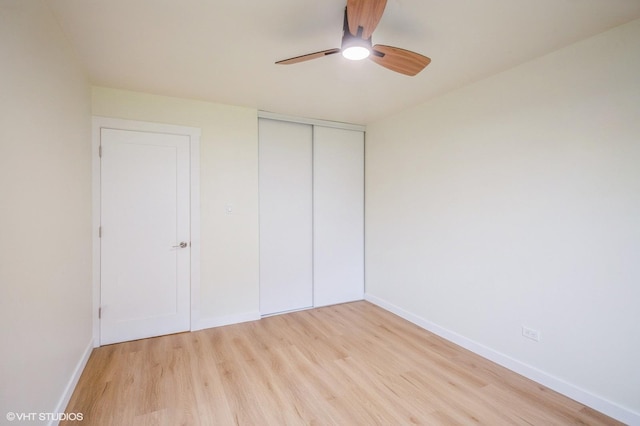 8880 Golf Rd Unit 1H, Des Plaines, IL 60016 - unfurnished bedroom with light wood-type flooring, a closet, baseboards, and a ceiling fan