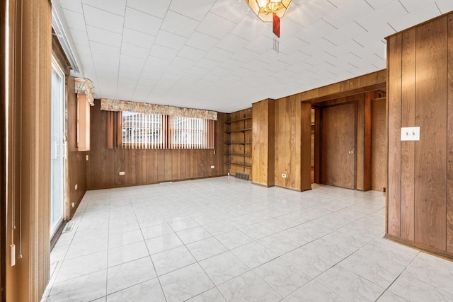 5261 N Natchez Ave, Chicago, IL 60656 - empty room featuring wooden walls and built in features