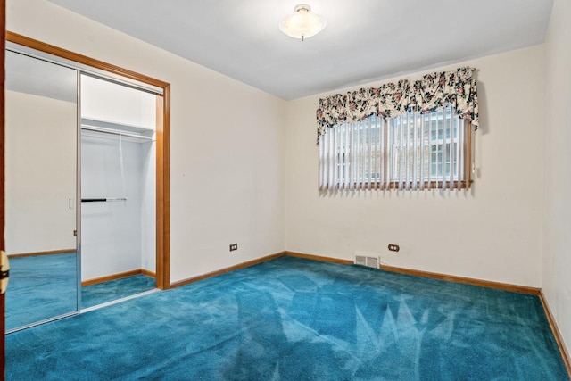 5261 N Natchez Ave, Chicago, IL 60656 - unfurnished bedroom featuring baseboards and carpet