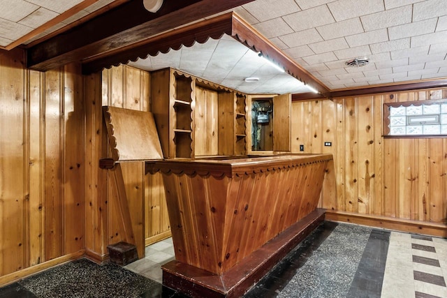 5261 N Natchez Ave, Chicago, IL 60656 - indoor dry bar featuring wood walls, tile patterned floors, and baseboards