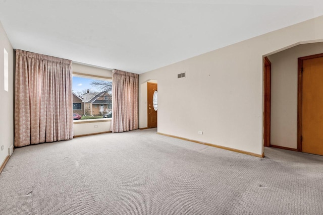 5261 N Natchez Ave, Chicago, IL 60656 - carpeted spare room with baseboards and arched walkways