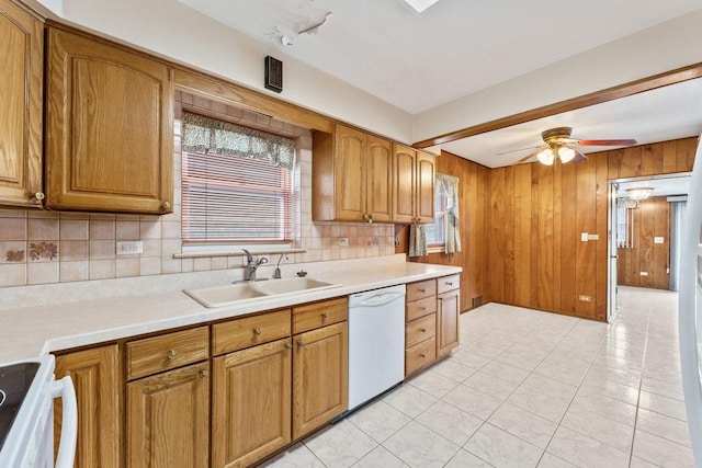 5261 N Natchez Ave, Chicago, IL 60656 - kitchen featuring dishwasher, a sink, brown cabinetry, light countertops, and ceiling fan