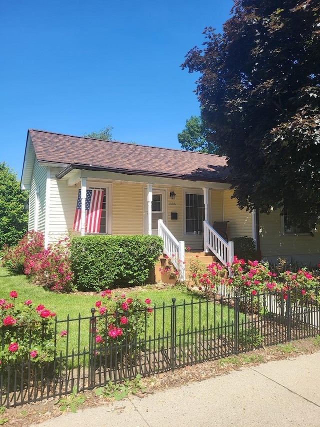 1006 N Park St, Streator, IL 61364 - ranch-style home with a porch and roof with shingles