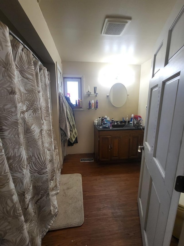 1006 N Park St, Streator, IL 61364 - full bathroom featuring vanity and wood finished floors