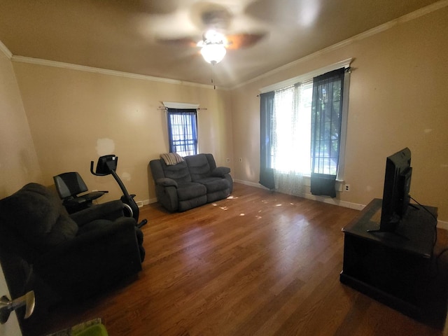 1006 N Park St, Streator, IL 61364 - living room featuring wood finished floors, a ceiling fan, baseboards, and crown molding