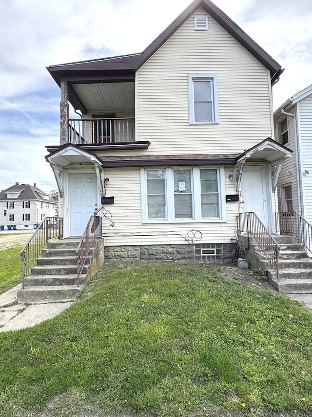 232-236 S 4th Ave, Kankakee, IL 60901 - view of front of property featuring a balcony and a front yard
