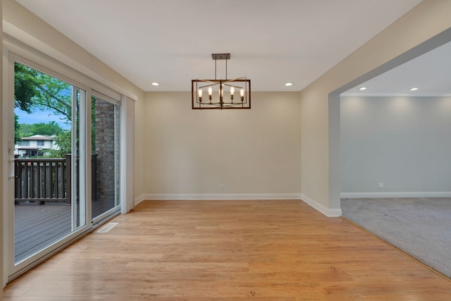208 Spring Ct, Bloomingdale, IL 60108 - unfurnished dining area with a chandelier, light wood-style flooring, and recessed lighting