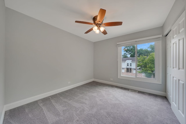 208 Spring Ct, Bloomingdale, IL 60108 - carpeted spare room with baseboards and ceiling fan