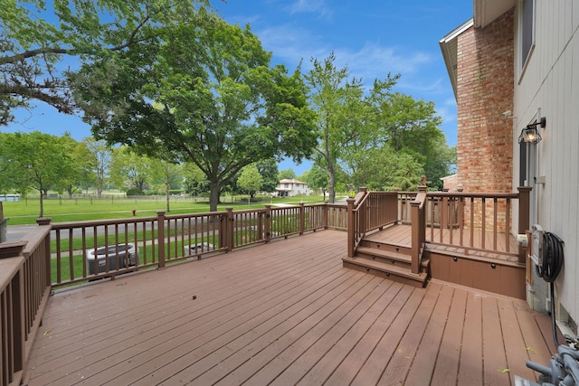 208 Spring Ct, Bloomingdale, IL 60108 - wooden deck with a lawn