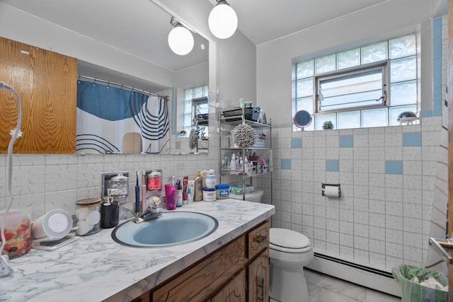 6004 S Keeler Ave, Chicago, IL 60629 - full bath featuring a baseboard radiator, tile walls, toilet, vanity, and marble finish flooring