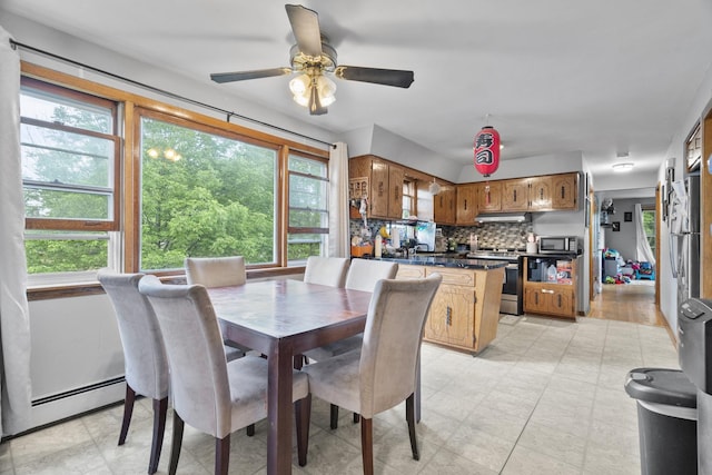 6004 S Keeler Ave, Chicago, IL 60629 - dining room with a baseboard heating unit and ceiling fan