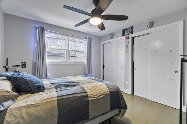 6004 S Keeler Ave, Chicago, IL 60629 - bedroom with multiple closets, wood finished floors, and ceiling fan