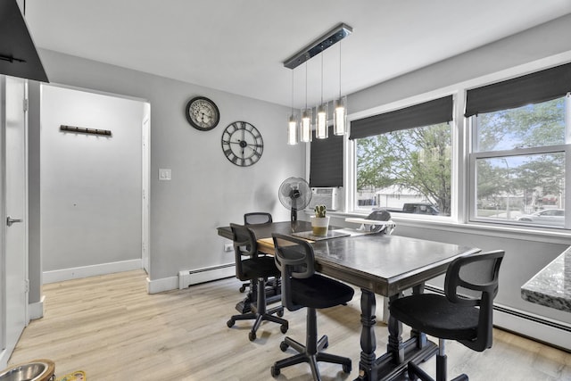 6004 S Keeler Ave, Chicago, IL 60629 - dining area with a baseboard radiator, plenty of natural light, and light wood finished floors