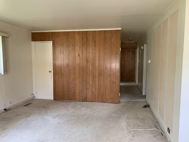 323 Windsor St, Park Forest, IL 60466 - unfurnished room featuring light carpet and wood walls
