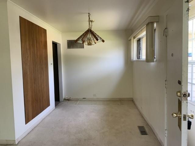 323 Windsor St, Park Forest, IL 60466 - unfurnished dining area featuring concrete flooring, plenty of natural light, and baseboards