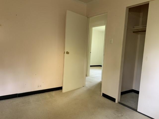 323 Windsor St, Park Forest, IL 60466 - unfurnished bedroom with a closet, light colored carpet, and baseboards