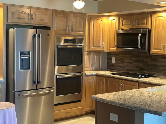 1133 N 7th St Unit 806, Rochelle, IL 61068 - kitchen featuring stainless steel appliances, decorative backsplash, and light stone counters