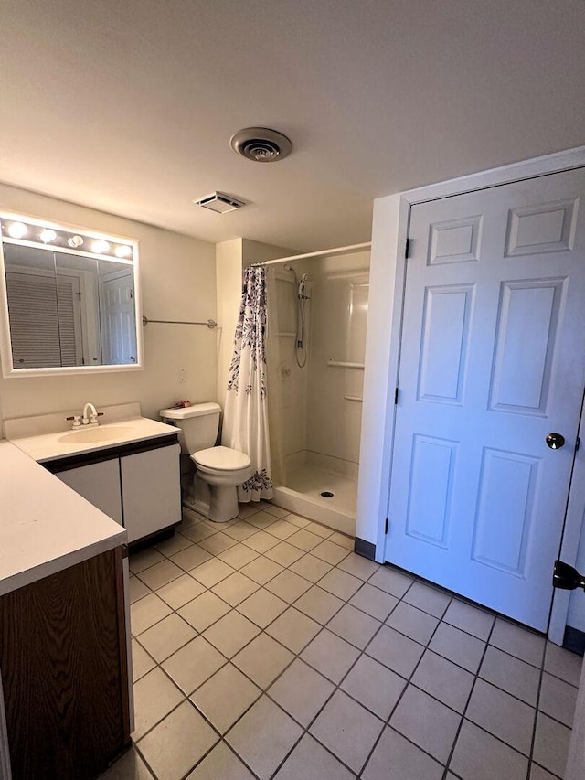 1133 N 7th St Unit 806, Rochelle, IL 61068 - bathroom featuring vanity, tile patterned flooring, a shower stall, and toilet